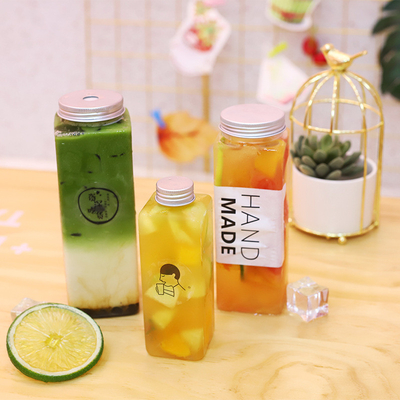 Các chai nước trà sữa hình vuông và hình tròn hiện đại chống rò rỉ với tay cầm